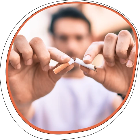 Man breaking a cigarette